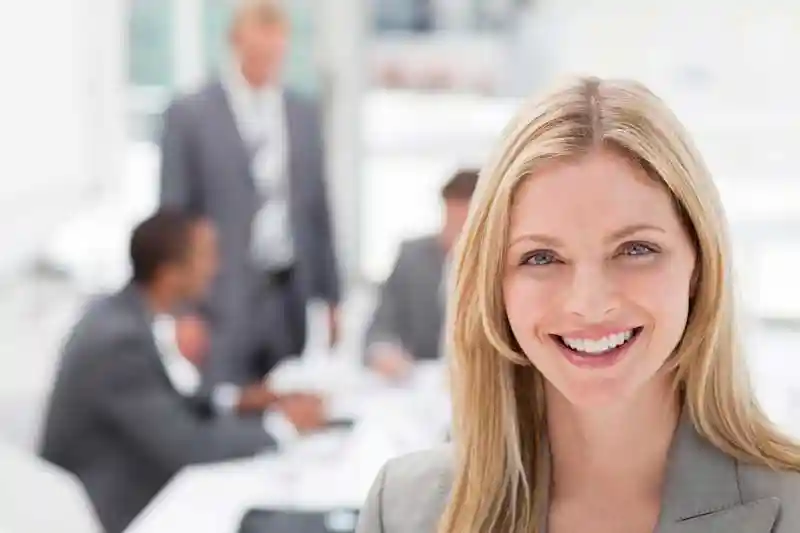 Woman at a computer looking at Document Management software